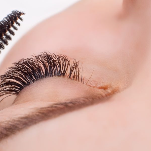 Eyelash Extension Procedure. Woman Eye with Long Eyelashes. Lashes, close up, macro, selective focus